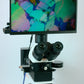 Polarising Microscope with Camera and Screen setup displaying polarised sand granules